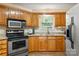 Updated kitchen with stainless appliances, granite counters, and ample cabinet storage at 1666 Sam Smith Rd, Fort Mill, SC 29708