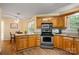 Cozy kitchen with stainless appliances, wood cabinets and breakfast nook for easy dining at 1666 Sam Smith Rd, Fort Mill, SC 29708