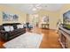 Inviting living room with wood floors, vaulted ceiling, and neutral paint. Cozy furniture arrangement and bright, open feel at 1666 Sam Smith Rd, Fort Mill, SC 29708