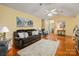 Spacious living room featuring hardwood floors, a vaulted ceiling, and stylish decor with backyard view at 1666 Sam Smith Rd, Fort Mill, SC 29708