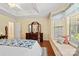 Relaxing bedroom features a large window seat, tray ceilings, and hardwood flooring at 1666 Sam Smith Rd, Fort Mill, SC 29708