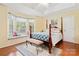 Spacious bedroom boasts a tray ceiling, bay window with seat, and a lovely four-poster bed at 1666 Sam Smith Rd, Fort Mill, SC 29708