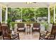 Inviting screened porch featuring comfortable seating and view of the lush backyard at 1666 Sam Smith Rd, Fort Mill, SC 29708