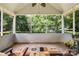 Spacious screened porch with large windows overlooking the backyard at 1666 Sam Smith Rd, Fort Mill, SC 29708