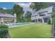 Beautiful backyard with a pool, patio, trampoline and lush landscaping at 1919 Shoreham Dr, Charlotte, NC 28211