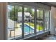 View of backyard swimming pool and manicured lawn from bedroom windows at 1919 Shoreham Dr, Charlotte, NC 28211