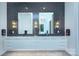 Contemporary bathroom featuring double sinks, geometric tile, and modern lighting at 1919 Shoreham Dr, Charlotte, NC 28211