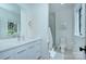 Bright bathroom showcasing a modern vanity, shower, and toilet at 1919 Shoreham Dr, Charlotte, NC 28211