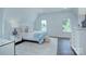 Light-filled bedroom boasting a bed, windows, and wood floors at 1919 Shoreham Dr, Charlotte, NC 28211