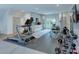 Exercise room featuring a treadmill, bike, weight rack and kitchenette area at 1919 Shoreham Dr, Charlotte, NC 28211