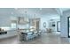 Spacious kitchen with a large island, seating, modern lighting, and open concept view to the dining area at 1919 Shoreham Dr, Charlotte, NC 28211