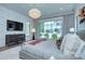 Bright main bedroom featuring a large window, neutral decor, and a mounted television at 1919 Shoreham Dr, Charlotte, NC 28211