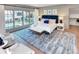 Comfortable main bedroom showcasing a large window with backyard and pool views at 1919 Shoreham Dr, Charlotte, NC 28211