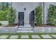 Outdoor shower with bluestone pavers and lush greenery around the perimeter at 1919 Shoreham Dr, Charlotte, NC 28211