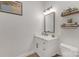 Modern bathroom with a white vanity, marble countertop, and stylish black hardware at 2006 Upstate Way, Charlotte, NC 28206