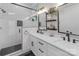 Bright bathroom with double vanity, marble countertops, and a glass-enclosed shower at 2006 Upstate Way, Charlotte, NC 28206