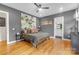 Relaxing bedroom with hardwood floors, a ceiling fan, and an ensuite bathroom at 2006 Upstate Way, Charlotte, NC 28206