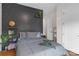Comfortable bedroom with a gray accent wall and stylish decor at 2006 Upstate Way, Charlotte, NC 28206