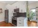 Beautiful kitchen showcasing stainless steel appliances, white cabinets, and elegant tile backsplash at 2006 Upstate Way, Charlotte, NC 28206