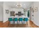 Modern kitchen with a large island, stainless steel appliances, bar seating, and hardwood floors at 2006 Upstate Way, Charlotte, NC 28206