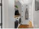 Well-organized laundry room with washer, dryer, and shelving at 2006 Upstate Way, Charlotte, NC 28206