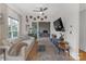 Bright living room with hardwood floors, a comfortable couch, and a sliding door to an outdoor seating area at 2006 Upstate Way, Charlotte, NC 28206