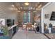 Inviting sunroom with string lights, modern decor, and an abundance of natural light at 2006 Upstate Way, Charlotte, NC 28206