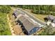 Aerial view of the back of modern townhomes with well-maintained yards at 2034 Suttonview Rd, Fort Mill, SC 29708