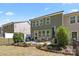 Backyard with patio, dining set, garden and dark green siding at 2034 Suttonview Rd, Fort Mill, SC 29708
