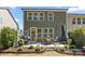 Backyard with patio, dining set, garden and dark green siding at 2034 Suttonview Rd, Fort Mill, SC 29708