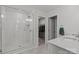 Bright primary bathroom with walk in shower, tile floors and access to closet at 2034 Suttonview Rd, Fort Mill, SC 29708