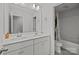 Bathroom with double sinks, shower, tile floors, and granite countertops at 2034 Suttonview Rd, Fort Mill, SC 29708