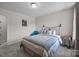 This bedroom features carpeted floors, neutral walls, and a white metal bedframe at 2034 Suttonview Rd, Fort Mill, SC 29708
