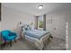 Cozy bedroom with a bed, chair, and natural light, creating a relaxing atmosphere at 2034 Suttonview Rd, Fort Mill, SC 29708