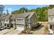 A charming, two-story townhouse features an attached garage, complemented by a well-maintained lawn and backyard at 2034 Suttonview Rd, Fort Mill, SC 29708