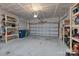 Empty two car garage with shelves for storage at 2034 Suttonview Rd, Fort Mill, SC 29708