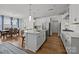Spacious kitchen featuring a large island with seating, stainless steel appliances, and access to the dining area at 2034 Suttonview Rd, Fort Mill, SC 29708