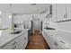 Well-lit kitchen featuring white cabinets, stainless steel appliances, and a center island with a sink at 2034 Suttonview Rd, Fort Mill, SC 29708