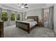 Serene main bedroom with tray ceiling, large windows, and neutral decor at 2034 Suttonview Rd, Fort Mill, SC 29708