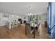 Spacious open concept living area featuring a modern kitchen, dining space, and cozy living room at 2034 Suttonview Rd, Fort Mill, SC 29708