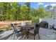 Beautiful patio with pavers, wrought iron fence, and outdoor dining set, perfect for entertaining guests at 2034 Suttonview Rd, Fort Mill, SC 29708