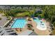 Aerial view of the community pool, featuring a lap pool, kiddie pool, sun loungers, and a pergola at 2034 Suttonview Rd, Fort Mill, SC 29708