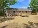 This home features a backyard with newly laid straw and a wood deck at 2362 Marett Blvd, Rock Hill, SC 29732