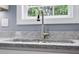 The kitchen sink is complemented by granite countertops at 2362 Marett Blvd, Rock Hill, SC 29732