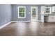 Open living room with hard surface floors and view of a modern kitchen at 2362 Marett Blvd, Rock Hill, SC 29732