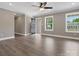 Open living space with wood-look floors, neutral walls, and large windows at 2362 Marett Blvd, Rock Hill, SC 29732