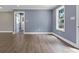 A well-lit living room features wood flooring and a freshly painted blue accent wall at 2362 Marett Blvd, Rock Hill, SC 29732