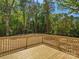 This outdoor wooden deck provides a private space surrounded by lush green foliage at 2362 Marett Blvd, Rock Hill, SC 29732