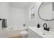 Well-lit bathroom featuring a modern vanity, a bathtub and a toilet with an integrated bidet at 2530 Cochrane Dr, Charlotte, NC 28269
