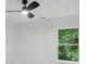 Bright bedroom featuring a modern ceiling fan and a light-filled window with natural views at 2530 Cochrane Dr, Charlotte, NC 28269